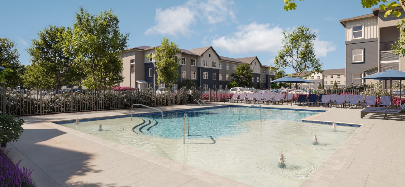 Resort-style swimming pool Pool with lounge chairs and umbrellas at our luxury apartments in Charlotte, NC.